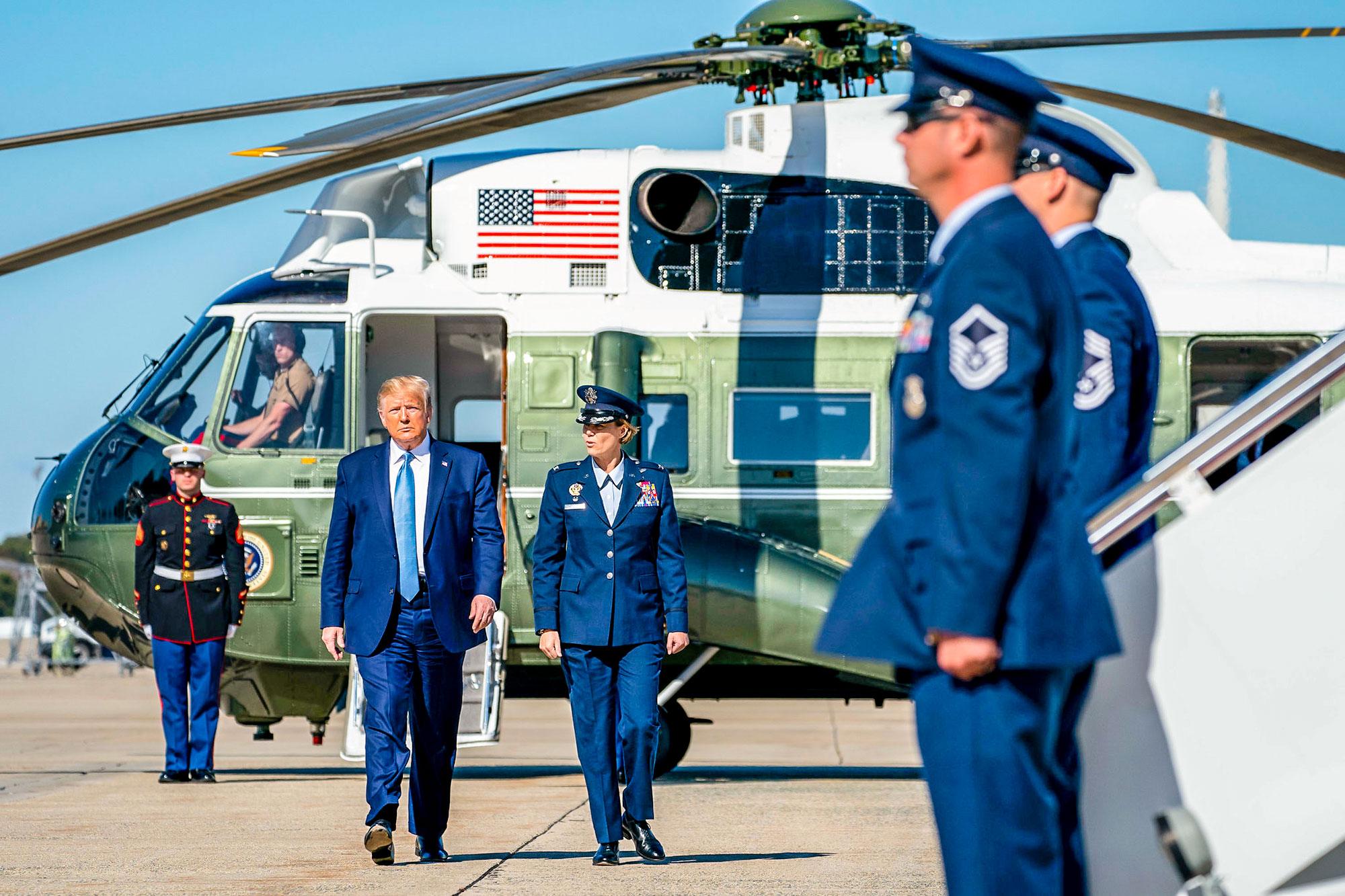 President Donald J. Trump disembarks Marine One at Joint Base Andrews, Md. Wednesday, Oct. 23, 2019, and is escorted by U.S. Air Force Col. Rebecca J. Sonkiss to Air Force One en route to Pittsburgh International Airport in Pittsburgh.