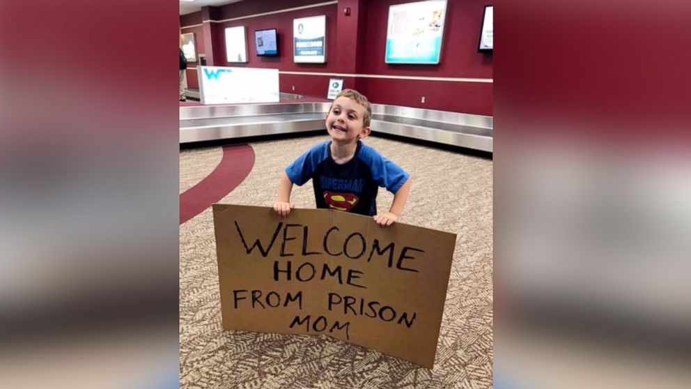 Daimen Nielsen, 4, greeted his mom Barbara Nielsen at Fort Smith Regional Airport in Arkansas with a sign that read, "Welcome Home From Prison Mom."